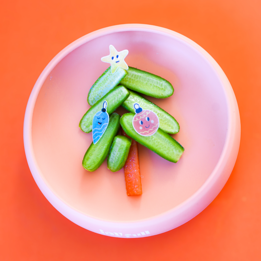 Christmas snack plate for kids featuring a Christmas tree made from cucumbers, carrots and Merry Sticks, Christmas themed edible stickers