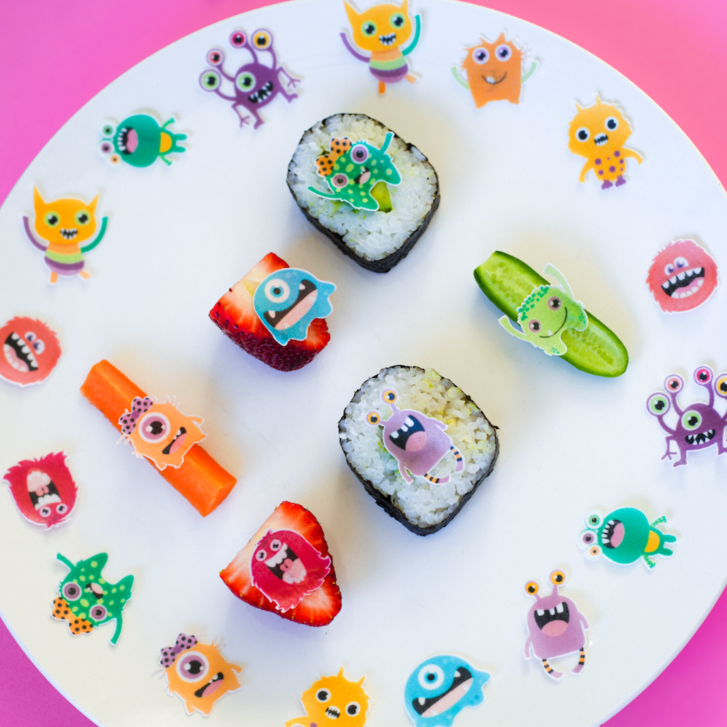 monster themed edible stickers on a healthy snack plate for kids