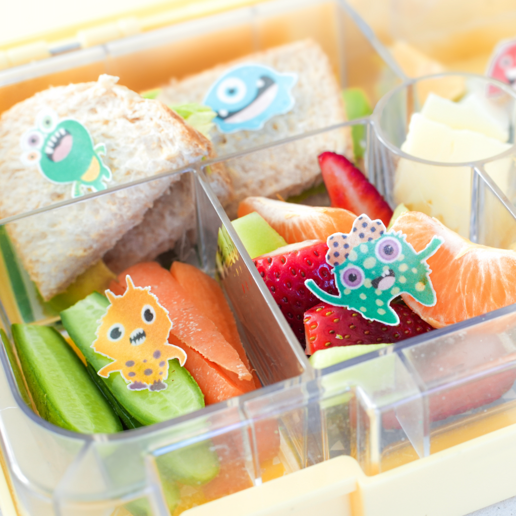 monster themed edible stickers as a bento accessories on  a healthy kids bento lunchbox. 